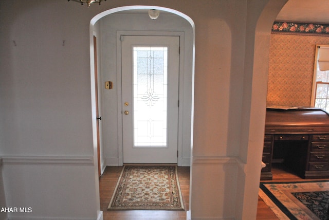 entrance foyer featuring arched walkways