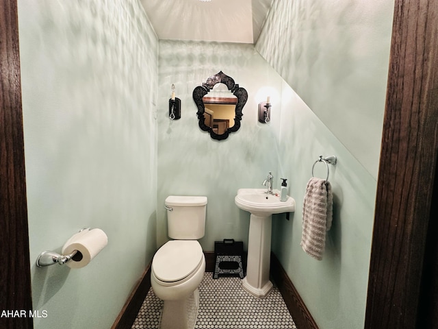 bathroom featuring tile patterned flooring, sink, and toilet