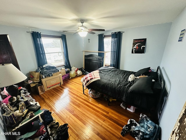 bedroom featuring hardwood / wood-style flooring and ceiling fan