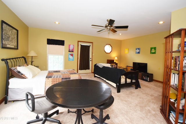 carpeted dining area featuring ceiling fan