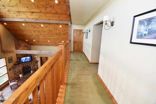 hall with carpet flooring and wooden ceiling