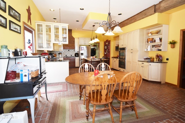 dining space with an inviting chandelier