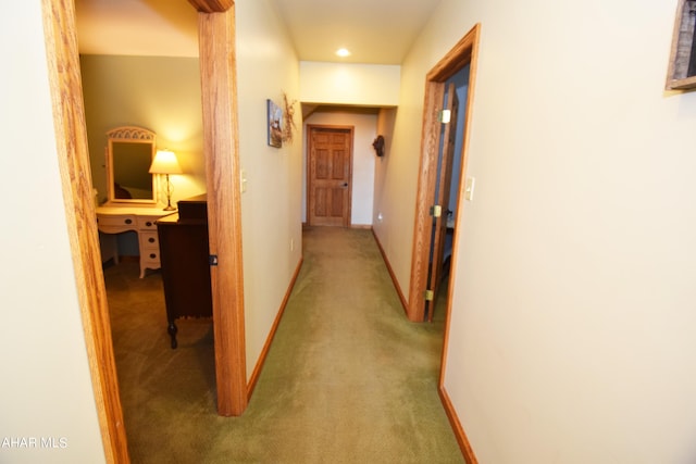 corridor with carpet flooring