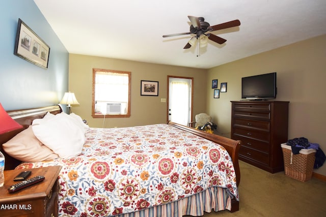 carpeted bedroom with ceiling fan and cooling unit