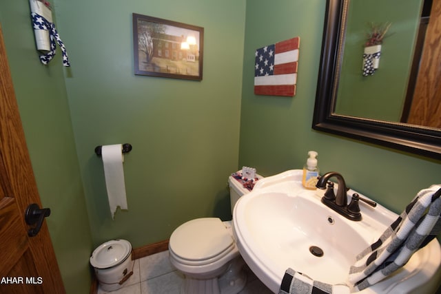 bathroom featuring tile patterned floors, sink, and toilet