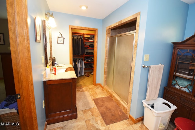 bathroom featuring vanity and separate shower and tub