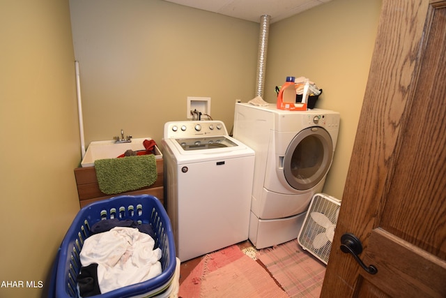 laundry area featuring washer and dryer and sink