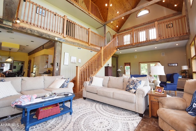 living room with high vaulted ceiling