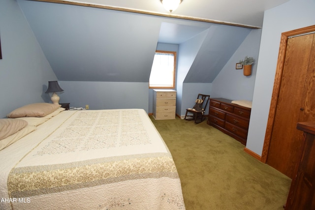 carpeted bedroom with vaulted ceiling