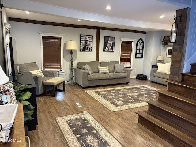 living room with wood-type flooring and beamed ceiling