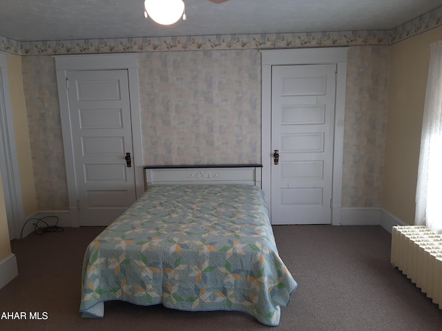 bedroom featuring baseboards and carpet flooring