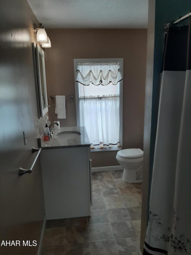 bathroom with vanity and toilet