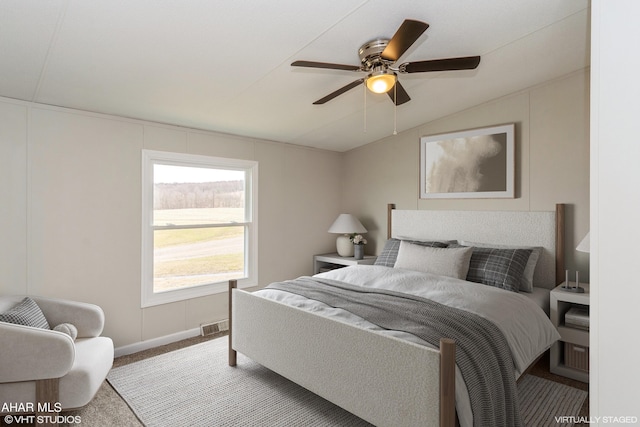 bedroom featuring ceiling fan, lofted ceiling, and carpet floors