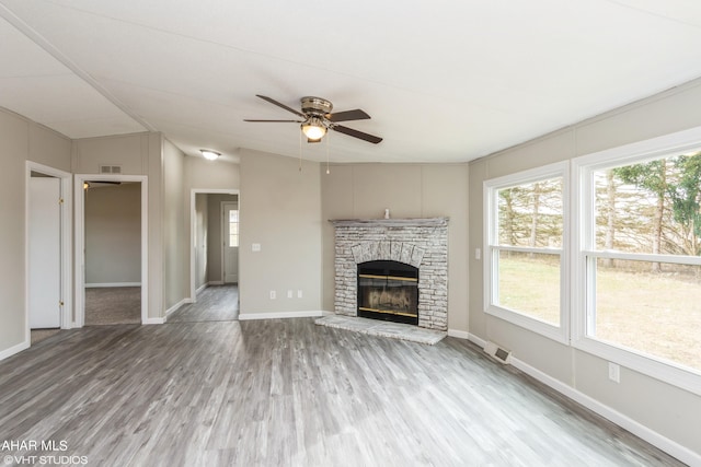 unfurnished living room with hardwood / wood-style floors and ceiling fan