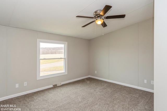 empty room with carpet and ceiling fan