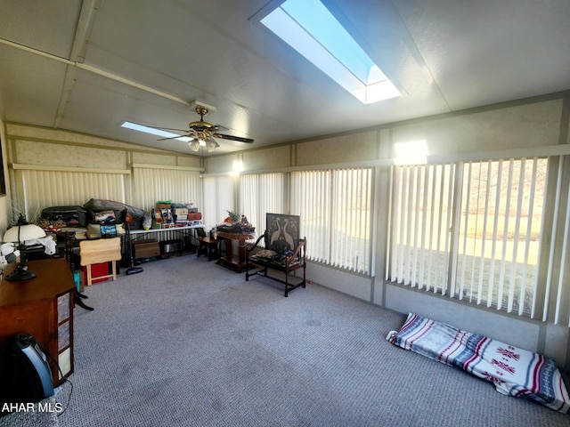 sunroom / solarium with lofted ceiling with skylight and a ceiling fan