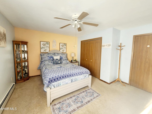 carpeted bedroom with a baseboard radiator, baseboards, a closet, and ceiling fan