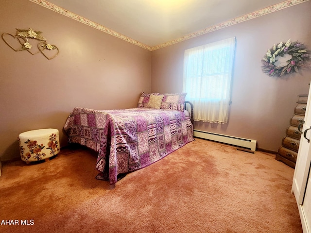 carpeted bedroom featuring a baseboard heating unit