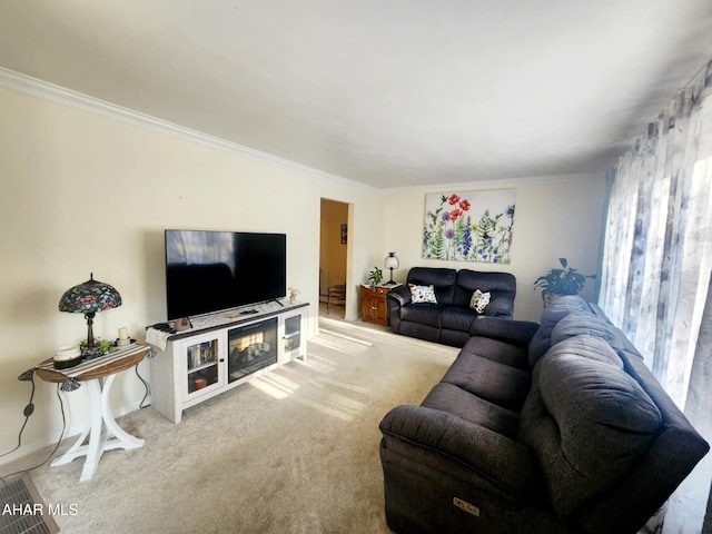 living area with carpet and crown molding