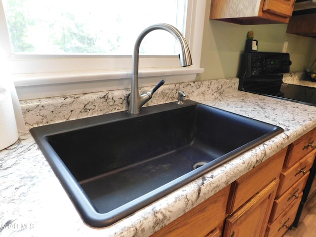 3004 Homers Gap Rd, Altoona, PA 16601 - kitchen view of brown cabinetry, range, and light countertops