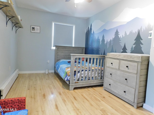 3004 Homers Gap Rd, Altoona, PA 16601 - bedroom featuring baseboard heating, light wood-style floors, and ceiling fan