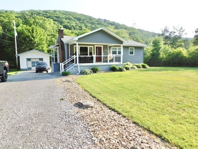 3004 Homers Gap Rd, Altoona, PA 16601 - ranch-style house featuring a chimney, a porch, an outbuilding, driveway, and a garage