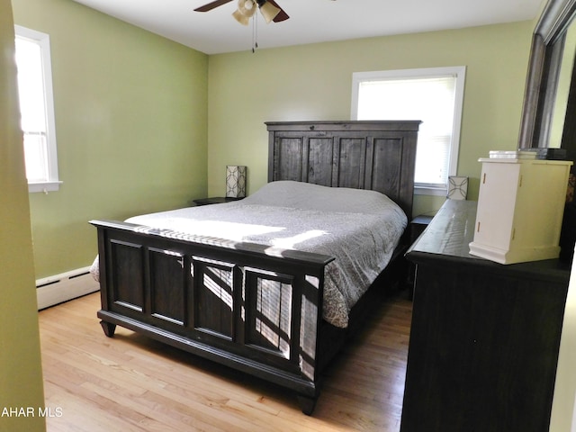 3004 Homers Gap Rd, Altoona, PA 16601 - bedroom with baseboard heating, light wood finished floors, and ceiling fan