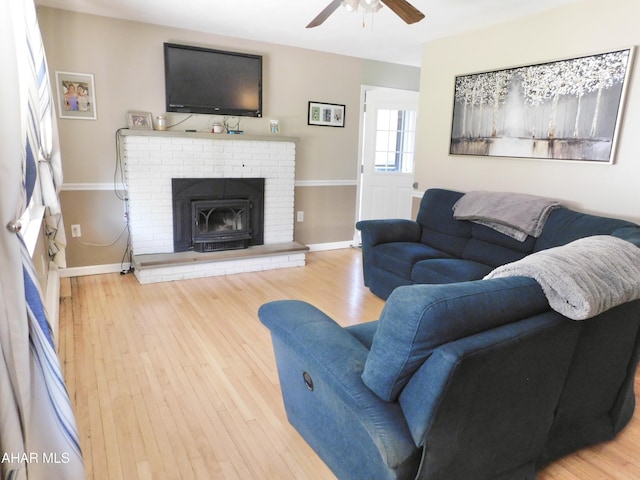 3004 Homers Gap Rd, Altoona, PA 16601 - living room featuring a ceiling fan, wood finished floors, and a brick fireplace