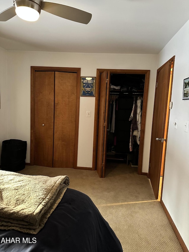 carpeted bedroom with ceiling fan