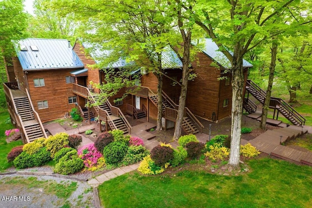 exterior space featuring a lawn and a deck