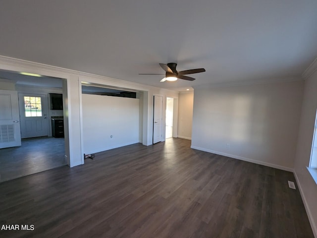 interior space featuring ceiling fan, ornamental molding, dark hardwood / wood-style floors, and a closet