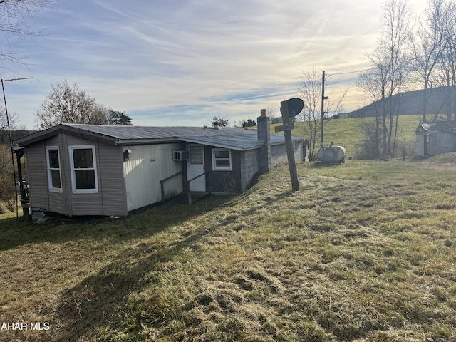 view of yard featuring an AC wall unit