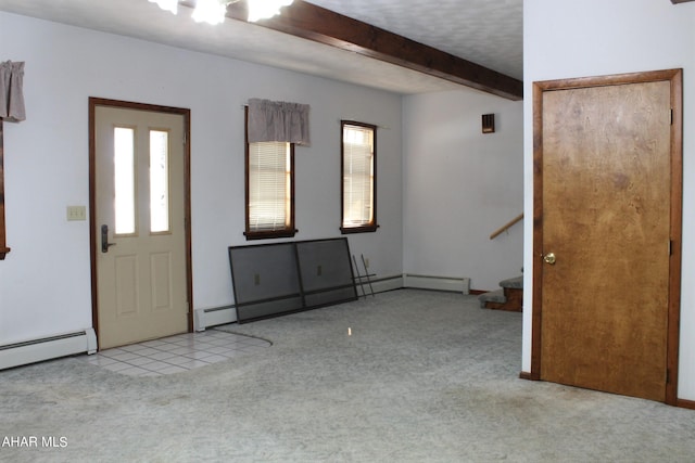 entrance foyer with beamed ceiling, light colored carpet, and a baseboard heating unit