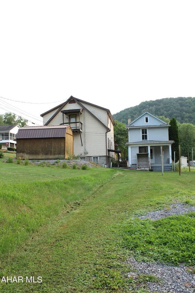 exterior space with a lawn and a porch