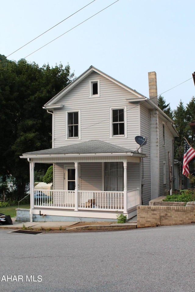 farmhouse inspired home with a porch