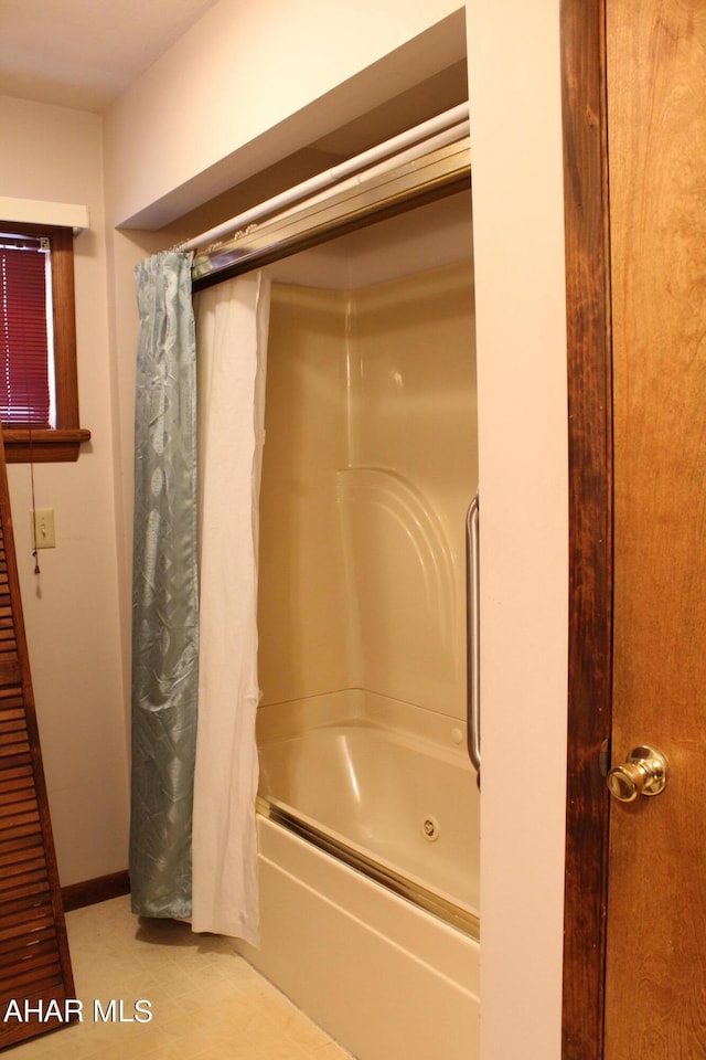 bathroom featuring shower / bath combination with curtain