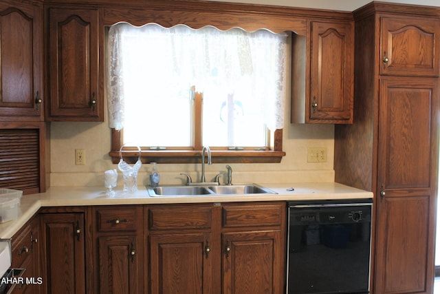 kitchen featuring black dishwasher and sink