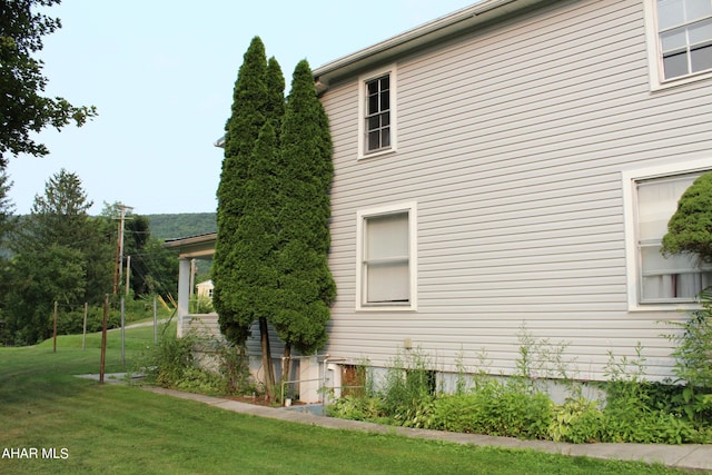 view of home's exterior featuring a yard