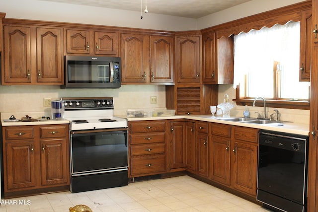 kitchen featuring sink and black appliances