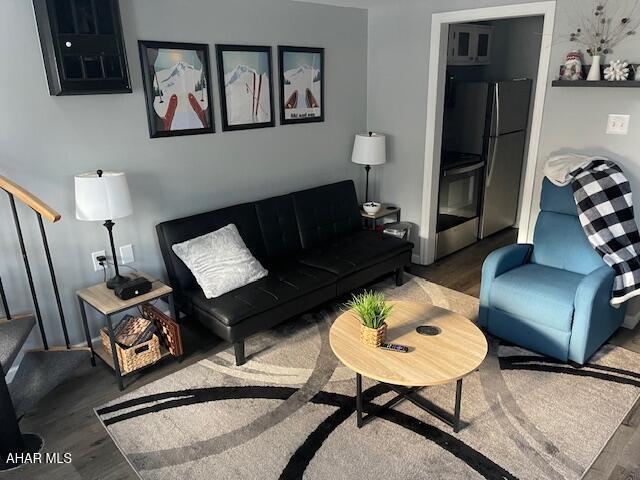 living room featuring dark hardwood / wood-style floors