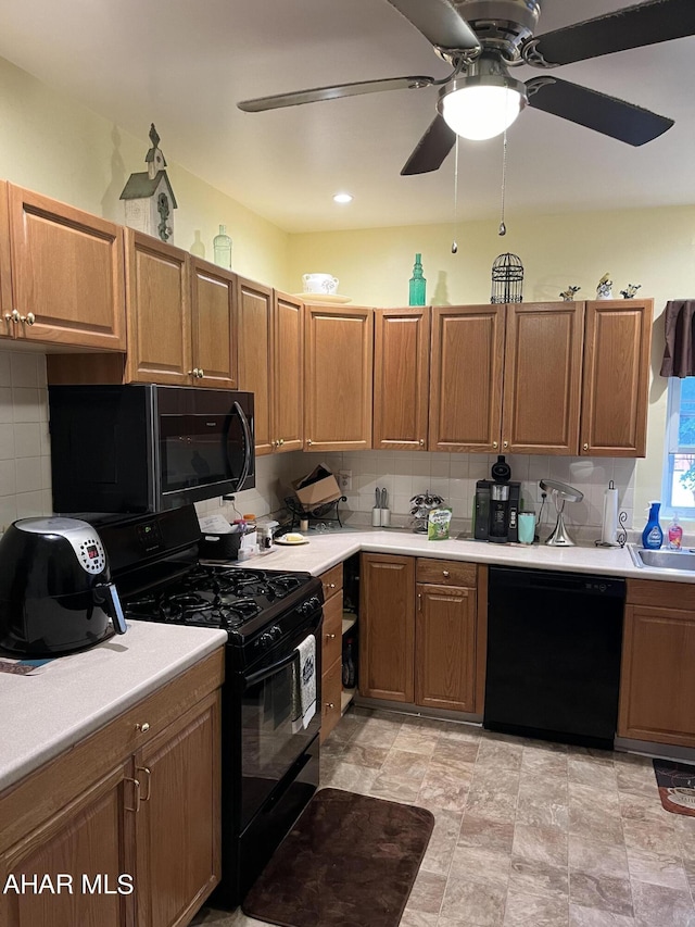 kitchen with ceiling fan, sink, backsplash, and black appliances