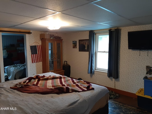 bedroom with a drop ceiling