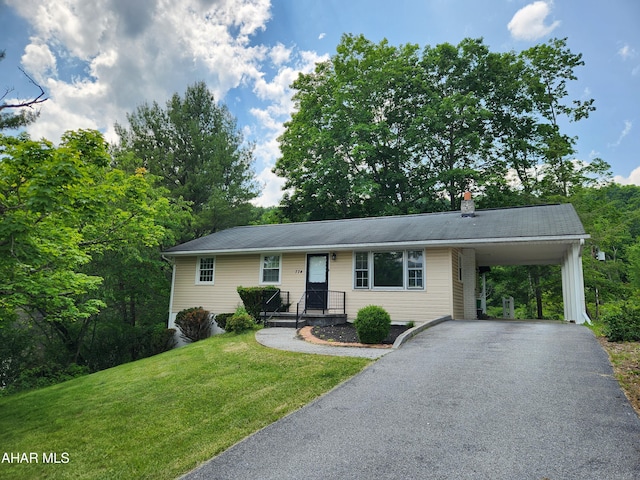 774 Hench St, Bedford, PA 15522 - ranch-style home featuring a front lawn, asphalt driveway, a chimney, and a carport