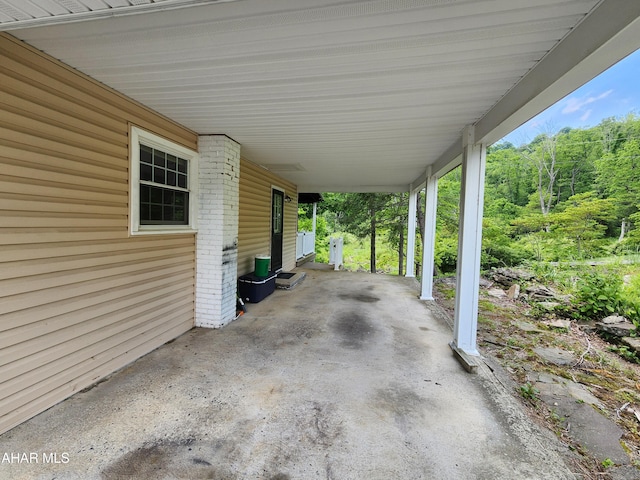 774 Hench St, Bedford, PA 15522 - view of patio with an attached carport and a wooded view