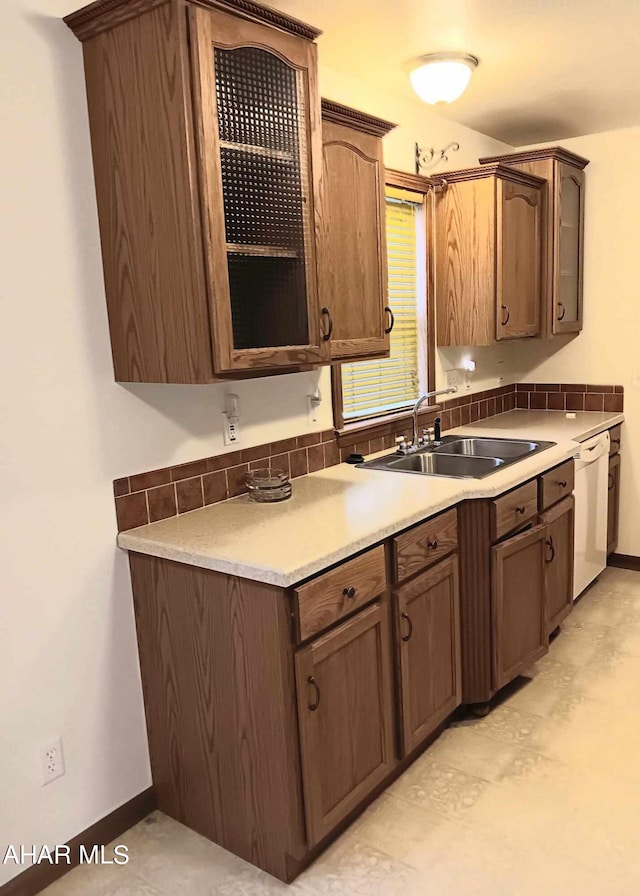 kitchen featuring sink and white dishwasher