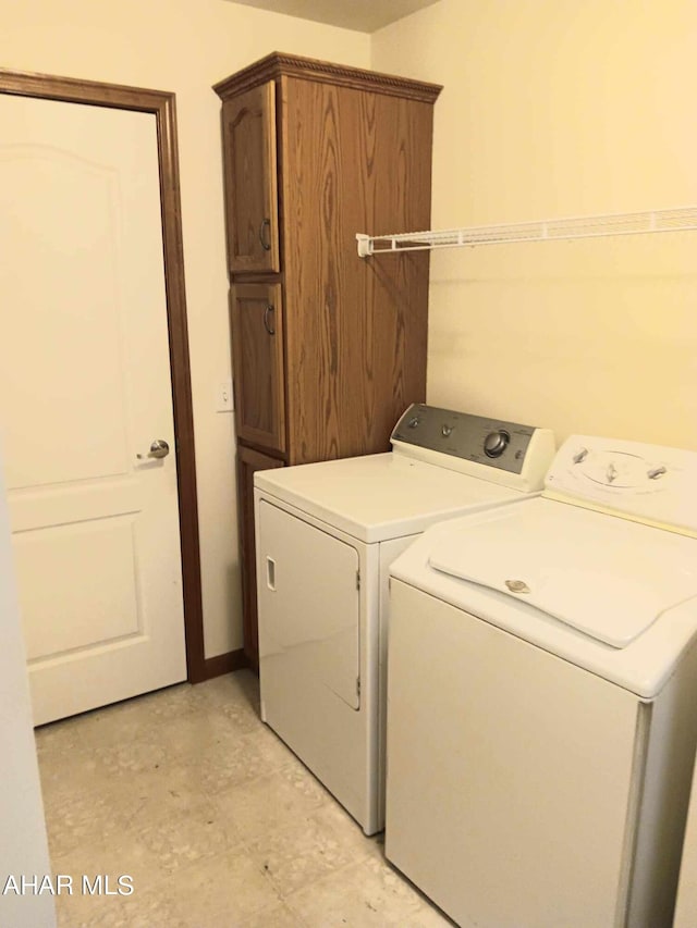 laundry area featuring cabinets and washer and dryer