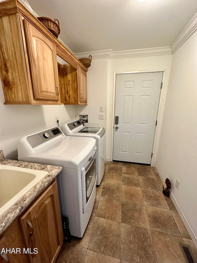 1650 Adams Run Rd, New Paris, PA 15554 - laundry room with washing machine and dryer, cabinet space, ornamental molding, and baseboards
