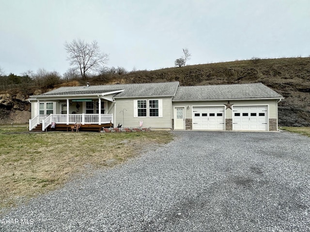 1650 Adams Run Rd, New Paris, PA 15554 - single story home with driveway, a garage, covered porch, and roof with shingles