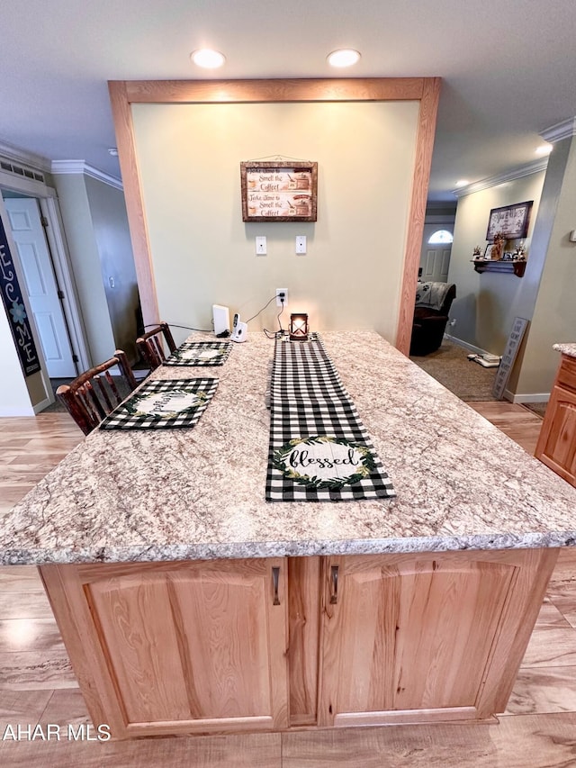 1650 Adams Run Rd, New Paris, PA 15554 - kitchen with ornamental molding, light brown cabinetry, a peninsula, light stone counters, and light wood finished floors