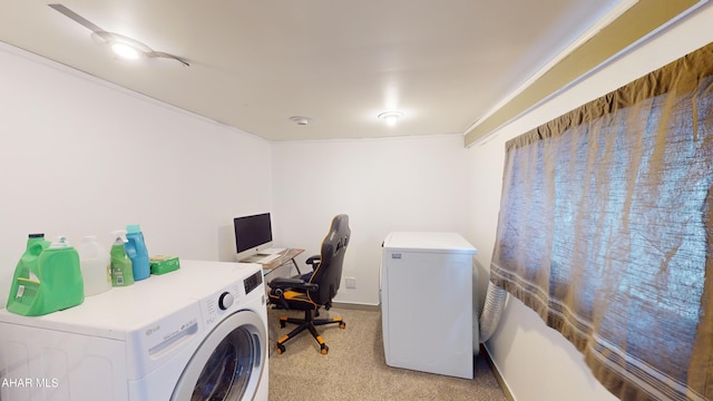 laundry room with washer and clothes dryer and light carpet